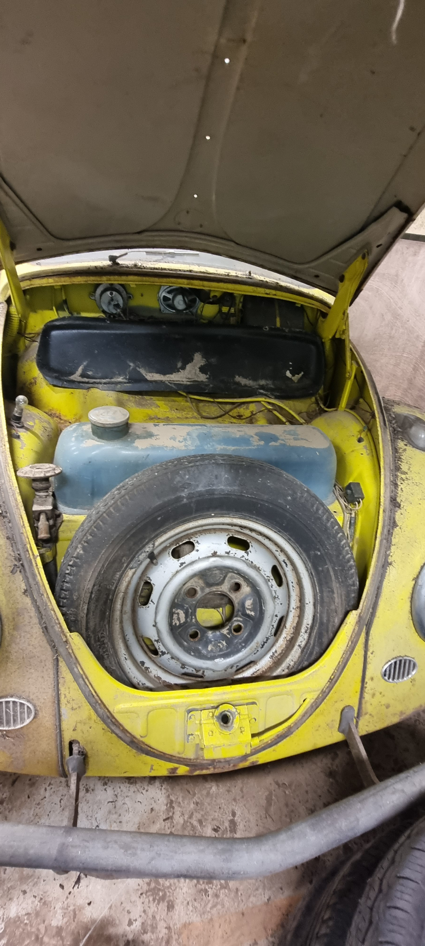 Under bonnet with spare wheel